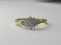 Diamond Cluster Ring Raised setting featuring small diamonds in graduated diamond shape cluster