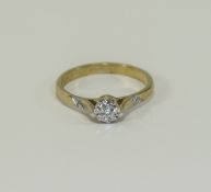 Diamond Solitaire Ring Central small solitaire in raised setting with banding pattern to shoulders