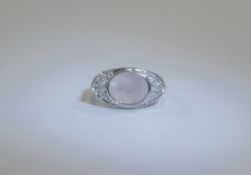 14ct Diamond and Rose Ring Oval shaped central faceted stone with diamond surround,