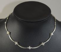 Silver Stone Set Necklace Short necklace featuring slim silver segments with 5 trefoil stone set