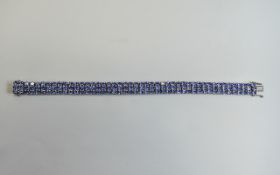 Tanzanite Three Row Bracelet, 27.5cts of oval cut tanzanites, of good colour,380 closely set in