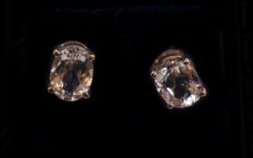 9ct Gold Stud Earrings. each set with an oval Kunzite stone.