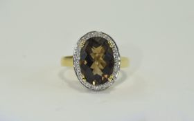 9 Carat Gold Diamond Dress Ring Central Topaz surrounded by round cut diamonds.