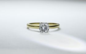 18 Carat Gold Single Stone Diamond Ring Set with a round modern brilliant cut diamond 4 claw