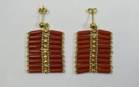 Ladies Coral & Gold Earrings. Indonesian coral cylindrical beads set between faceted gold bauble