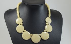 Ivory Necklace With Graduated Disc Detail.