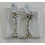 Impressive Pair of Platinum French Set Pair of Diamond Drop Cluster Earrings.