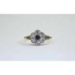 18 ct Gold Set Sapphire And Diamond Cluster Ring Flower head setting. The central Sapphire