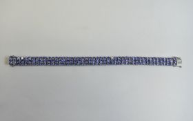 Tanzanite Three Row Bracelet, 27.5cts of oval cut tanzanites, of good colour,380 closely set in