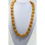 Early 20thC Egg Yolk Amber Necklace Consisting Of 28 Natural Amber Beads Of Uniform Size Approx