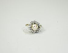 14 Carat Gold Diamond Dress Ring. Central pearl surrounded by 10 round brilliant cut diamonds.