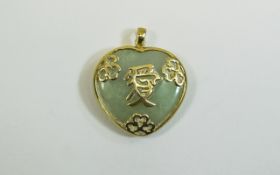 9 Ct Gold Heart Shaped Jade Set Pendant with Chinese script to centre. Jade of good colour. Fully
