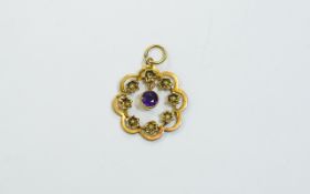 9ct Early 20thC Gold Pendant, flower head design with central amethyst. Marked 9ct.
