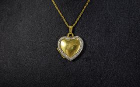 14ct Gold and Diamond Set Heart Shaped Pendant / Locket, Attached to a 14ct Gold Chain.