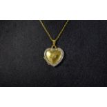 14ct Gold and Diamond Set Heart Shaped Pendant / Locket, Attached to a 14ct Gold Chain.