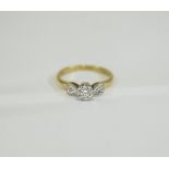 18ct Gold Inclusion Set Diamond Ring. The Central Diamond with Diamond Shoulders.