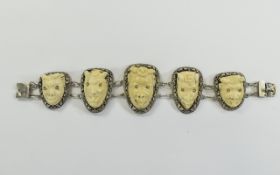 Egyptian Carved Ivory Bracelet 5 graduating silver panels surmounted by carved ivory devil masks.