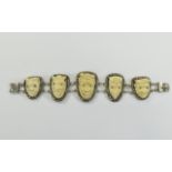 Egyptian Carved Ivory Bracelet 5 graduating silver panels surmounted by carved ivory devil masks.