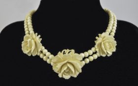 A Fine Antique Ivory Bead Necklace with 3 Finely Carved Roses to Central Part of Necklace.