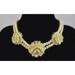 A Fine Antique Ivory Bead Necklace with 3 Finely Carved Roses to Central Part of Necklace.