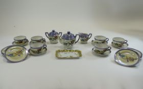 Tin of Mixed Japanese Serveware Includes cups, saucers and teapot in fancy iridescent bird and