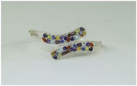 Multi Gemstone Crossover Bangle, set with fire opal, amethyst, sky blue topaz, peridot, rhodolite