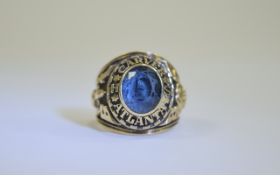 American 10ct Gold College Ring 1982 Atlanta set with blue stone. Gross weight 18 gramms.