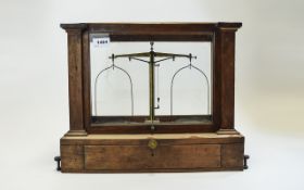 Glass cases lab scales, dating from the