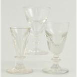 Three various Georgian toasting glasses, assorted patterns, 11cm, 10cm and 11cm.