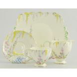 Foley china part tea set, yellow ground with floral decoration, to include sugar bowl, milk jug,