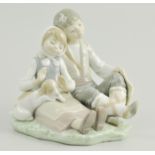 Lladro group of a seated boy and girl with puppy, 16cm.