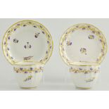 Pair of Derby puce, marked tea bowls and saucers,