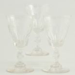 Georgian wine glass, engraved vine to rim, faceted bowl, stem and knop, height 14cm and two others,