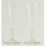 Pair of champagne flutes, circa 1770, trumpet shaped with faceted lower bowl,