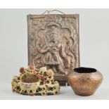 An Indian brass plaque set with deity, together with assorted Eastern wares.