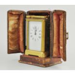 French brass travel clock, plain white dial, in original morocco bound case,