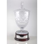 A Bohemian lead crystal covered vase,  a racing trophy on a plinth, 46cm, boxed.