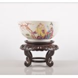 A Chinese famille rose circular bowl, Qianlong, painted with three figures, in coloured enamels,