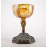 Bohemian amber overlaid goblet, wheel engraved panels, painted in black enamel, damaged,