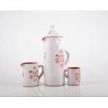 Slip decorated coffee set, painted floral decoration, (9).