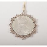 White metal pendant set with a treasure trove coin, in a Spink's box labelled Lucayan Beach,