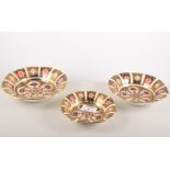 A set of three Royal Crown Derby graduating circular dishes, 1937, Old Imari pattern,