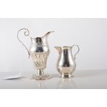 A Victorian silver pear shaped cream jug, by Holland, Son and Slater, London 1880,