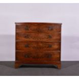 Bowfront chest of drawers, with two short and three long graduating drawers, brass plaque handles,