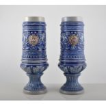 Pair of German stoneware vases, in shallow relief, two stoneware hunting jugs,