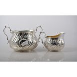 Victorian silver three piece teaset comprising teapot, milk jug and sugar bowl, embossed,