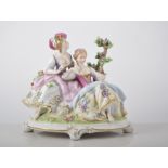 Collection of ten German porcelain figural groups, in period costume,