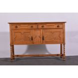 1940s oak sideboard, boarded top, two frieze drawers above cupboards, with geometric mouldings,