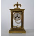 Four glass brass clock, with mercury pendulum twin train movement striking on a gong,