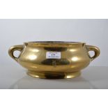 Chinese brass censer, compressed form with twin handles, width 31cms, bears six character mark.